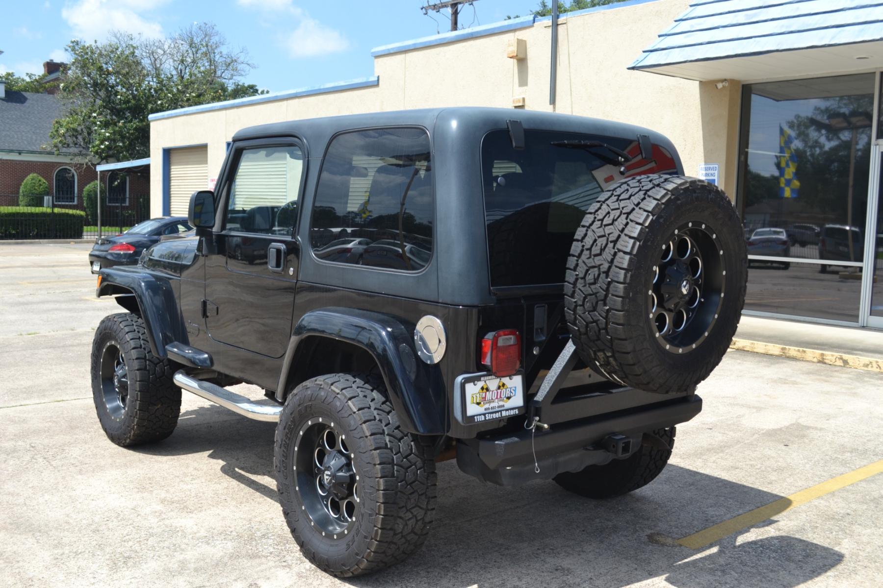 2003 BLACK /BLACK Jeep Wrangler X (1J4FA39S13P) with an 4.0L L6 OHV 12V engine, 4-Speed Automatic | 5-Speed Manual transmission, located at 1355 North 11th Street, Beaumont, 77702, (409) 832-0006, 30.094290, -94.130096 - Photo #2